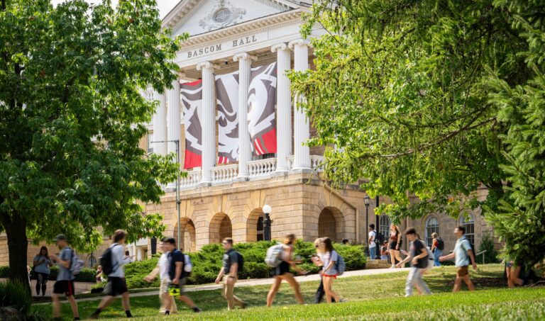 Students walking on Bascom Hill on a beautiful summer day