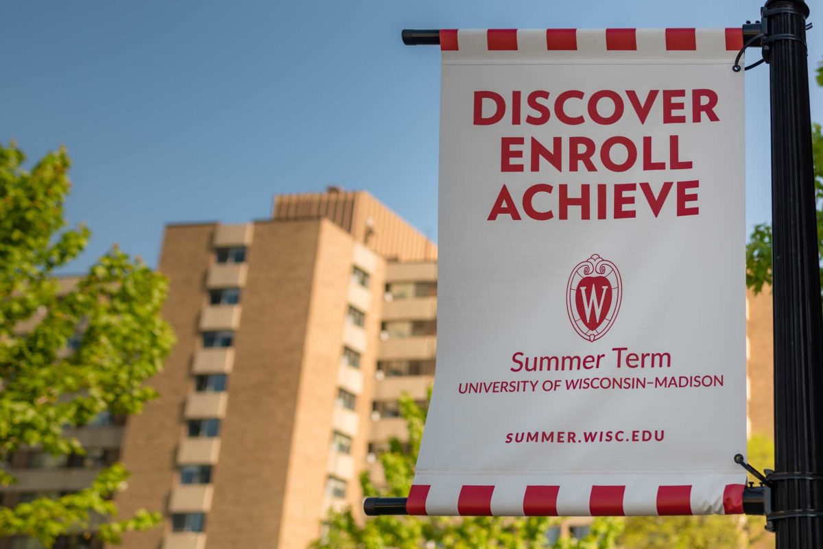 banner on campus that reads Discover, Enroll, Achieve
