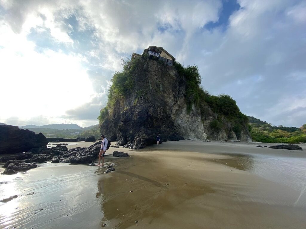 Beach, cliffs and blue sky with some clouds in Ecuador