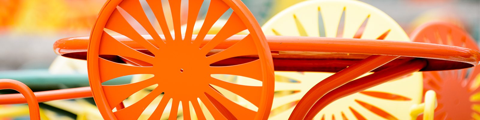 Close up shot of bright orange and yellow Memorial Union Terrace sunburst chairs