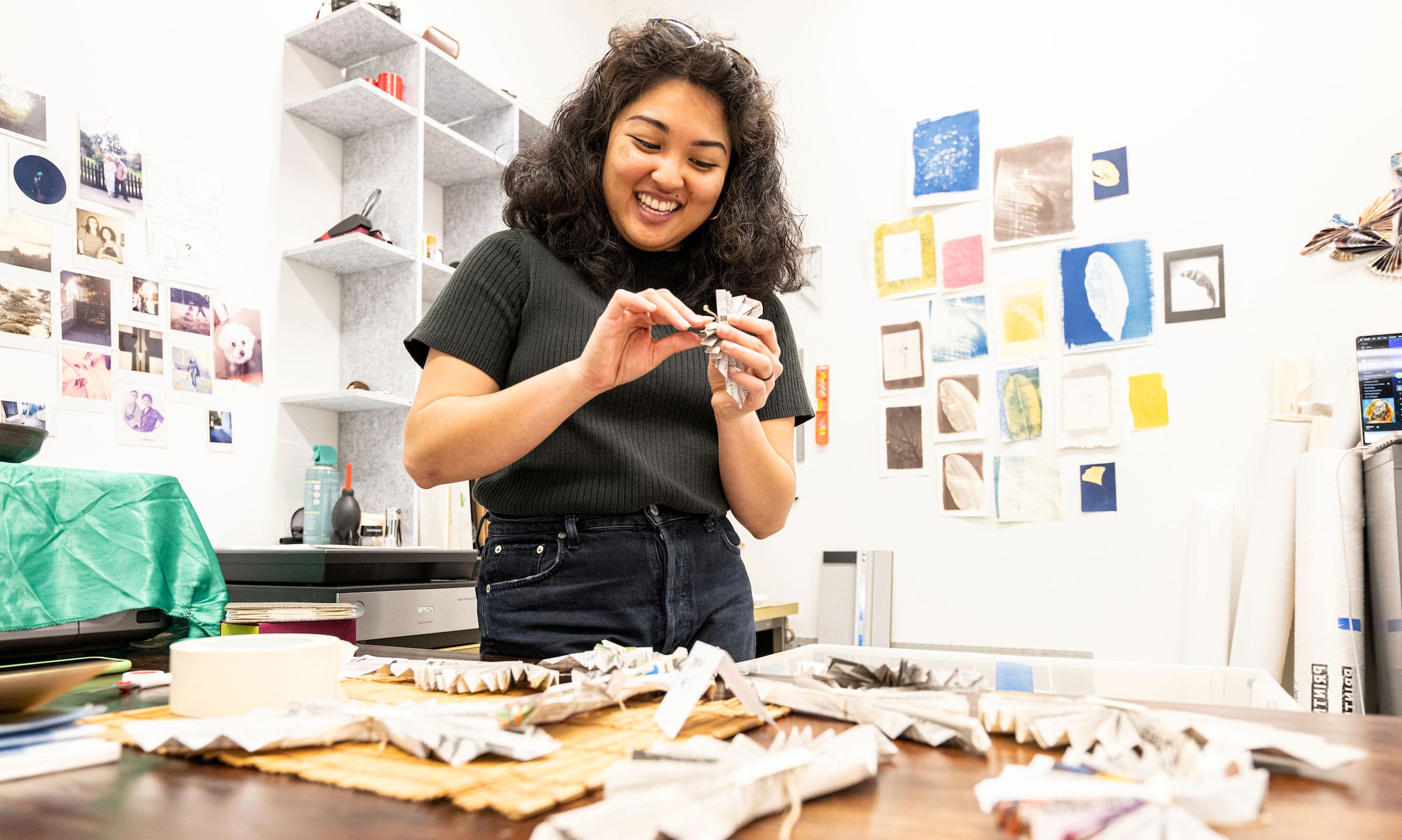 Student working on paper arts in an art studio on campus