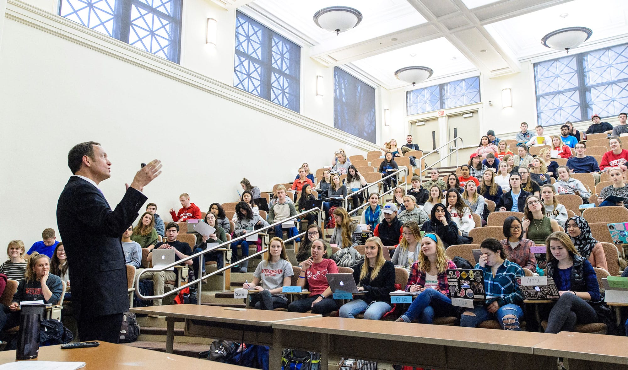 A professor giving a class of students a lecture.