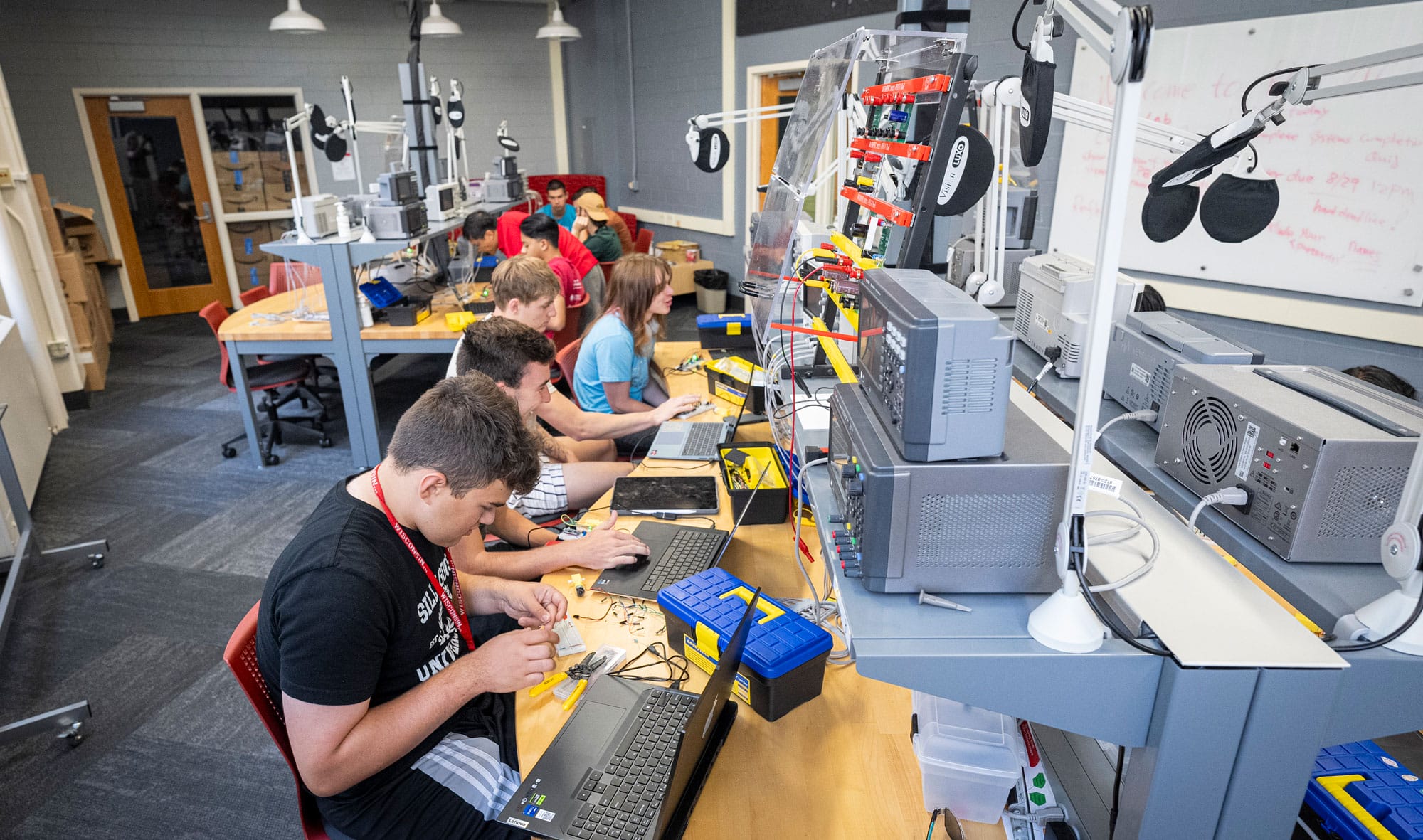 A class of engineering students studying.