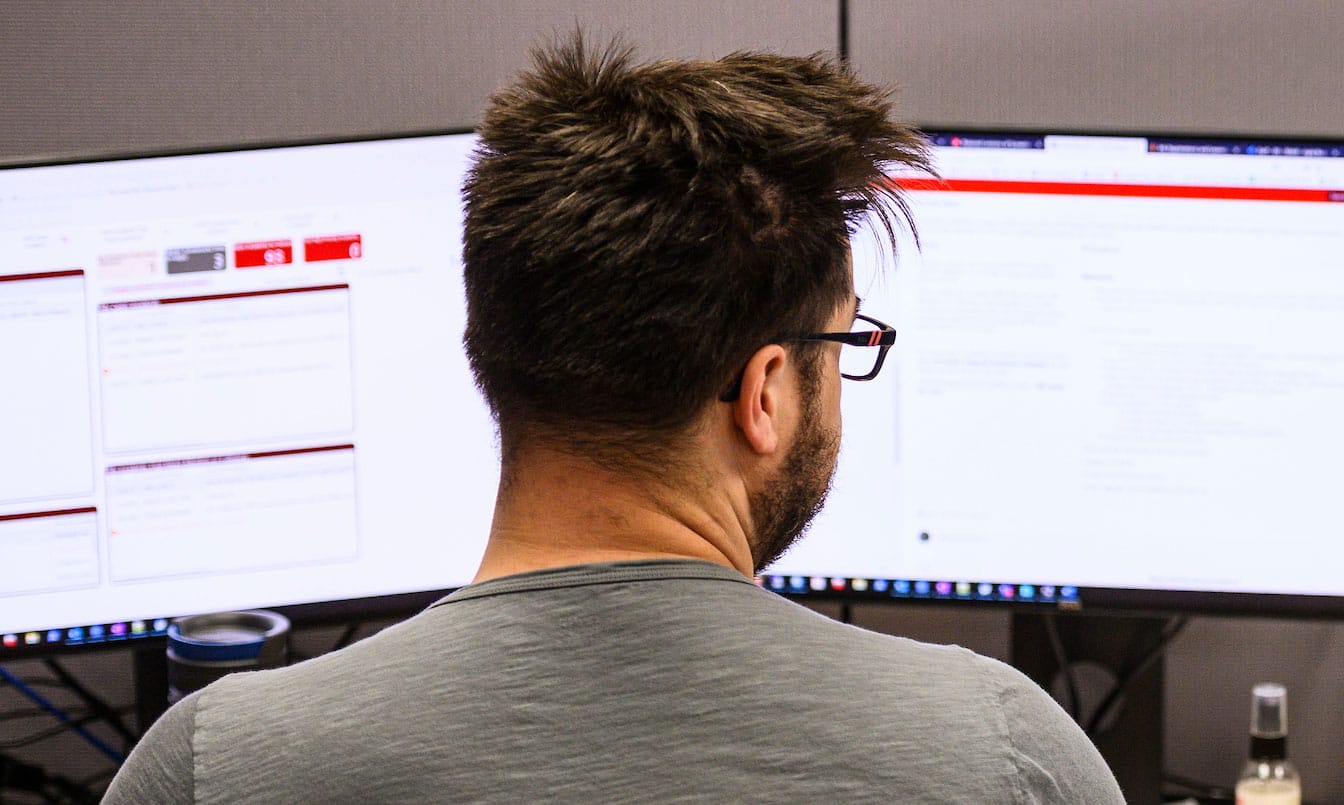 DoIT employee working at a computer