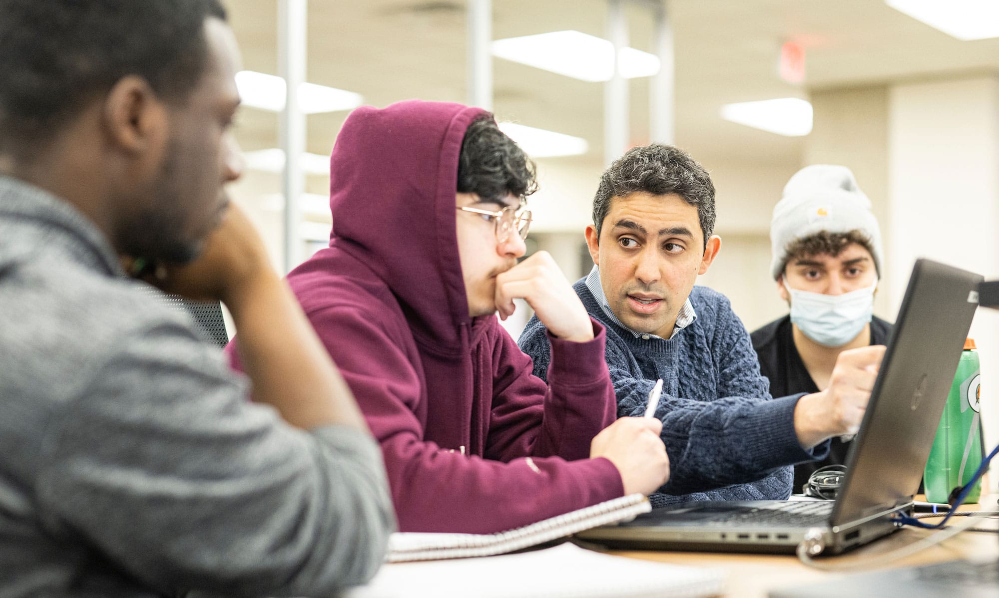 Professor Kassem Fawaz speaking with Engineering students 