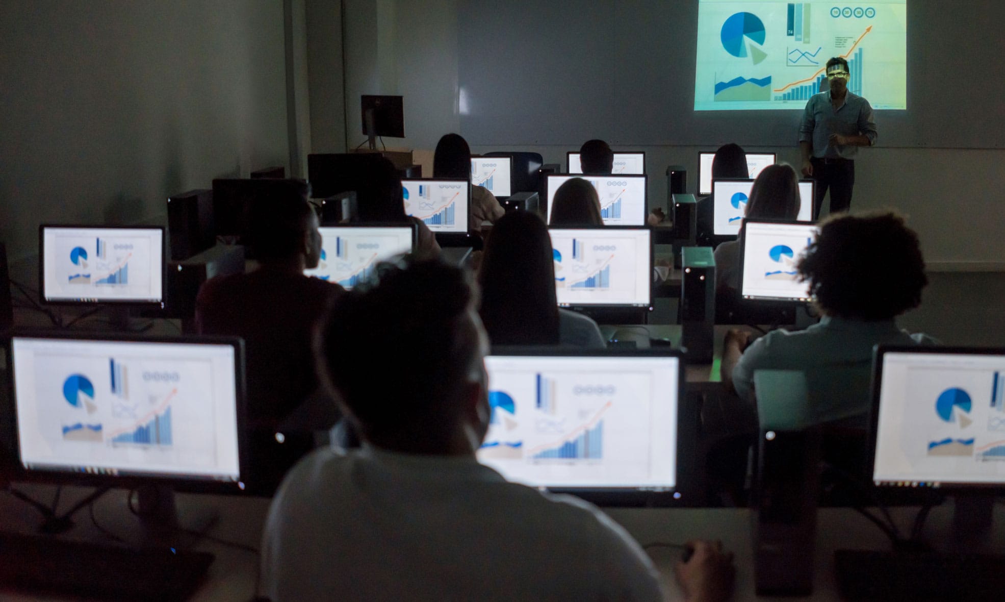 Students working on computers in an Economics class