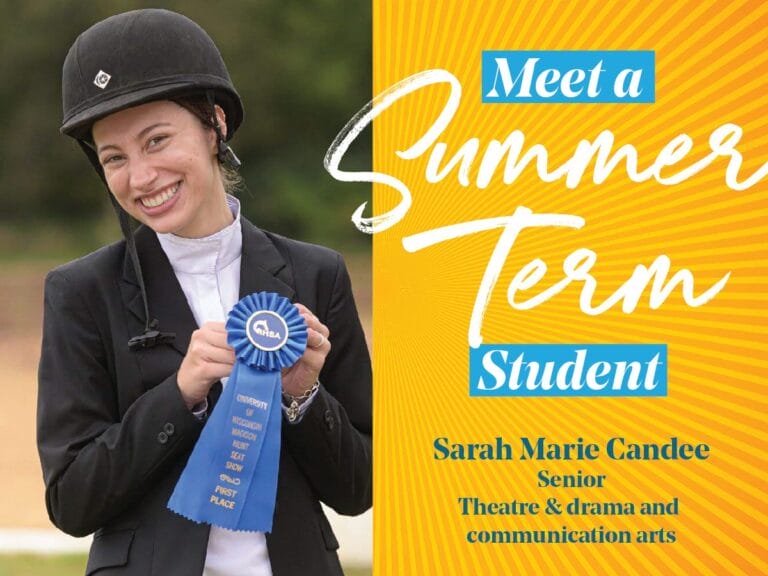 Sarah Candee holding a blue ribbon in her equestriam clothing