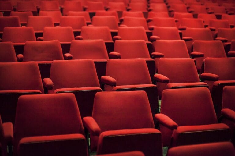 Empty red seats in a theater