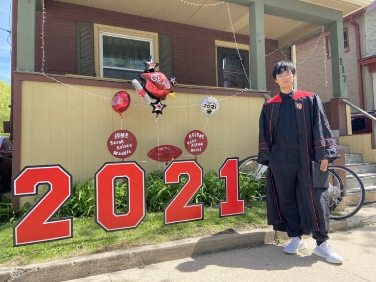 Austen Fan in cap and gown