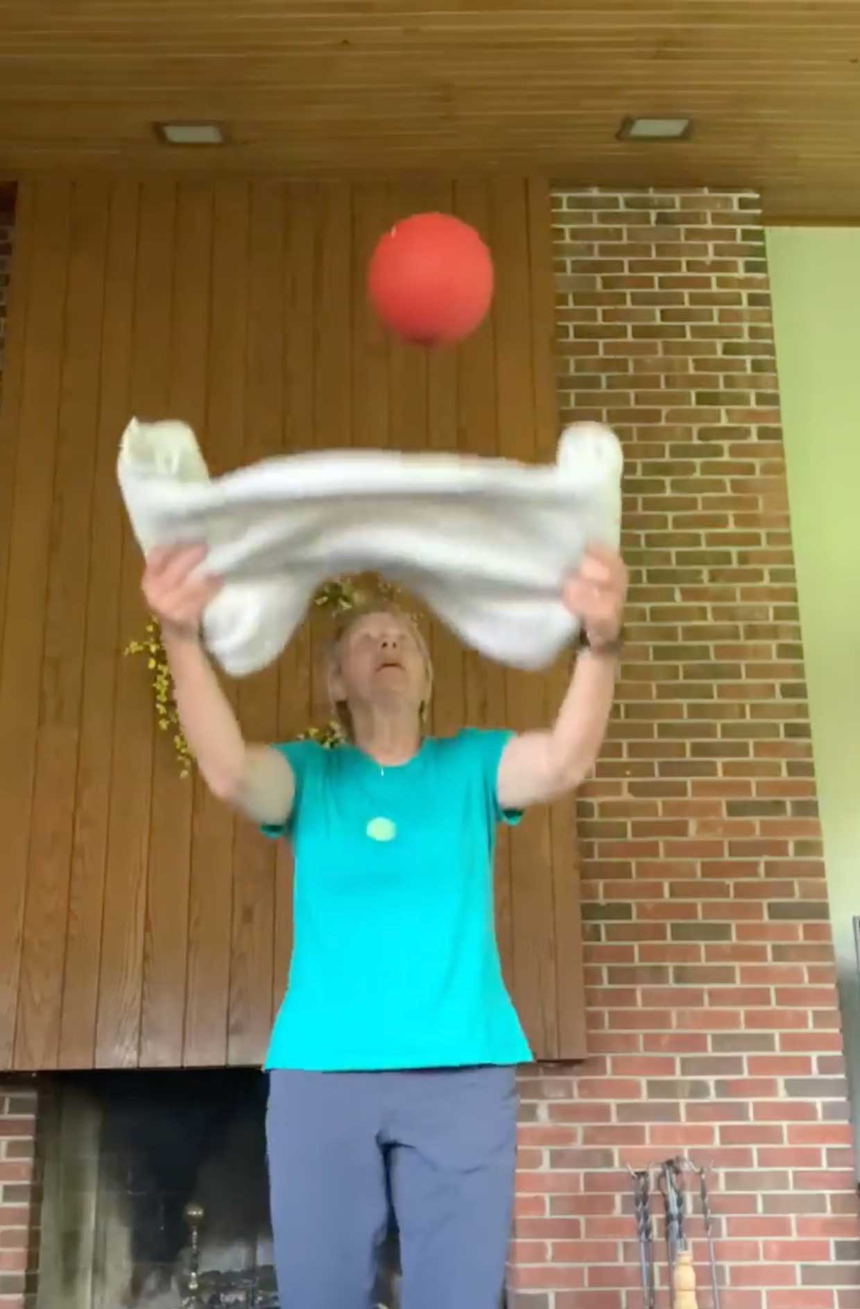 Cindy Kuhrasch tossing a ball up with a towel