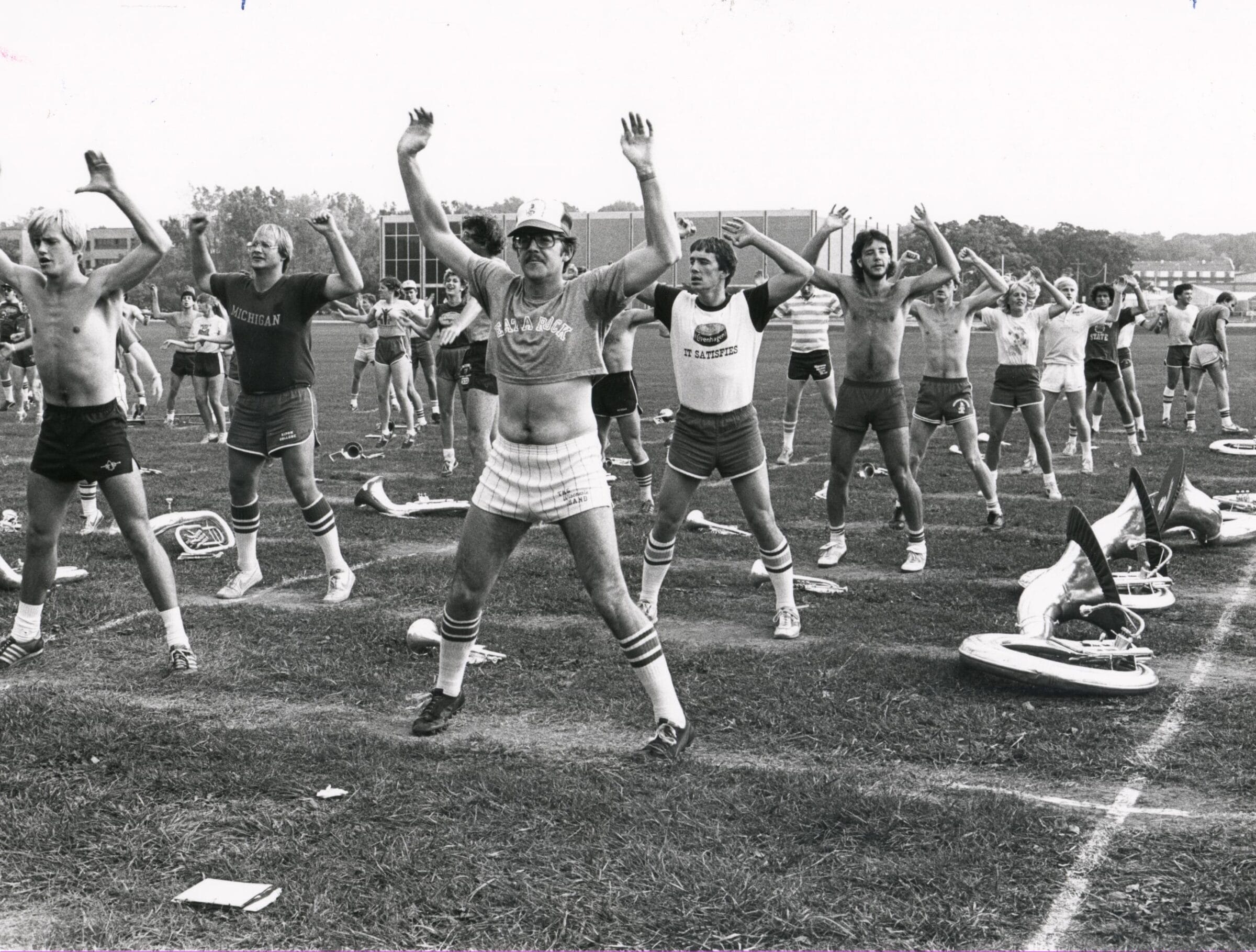 A group of people doing calisthenics.