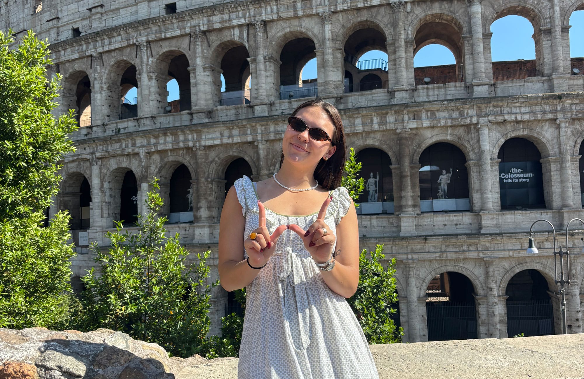 Student Morgan Ramsey posing in front of the colosseum