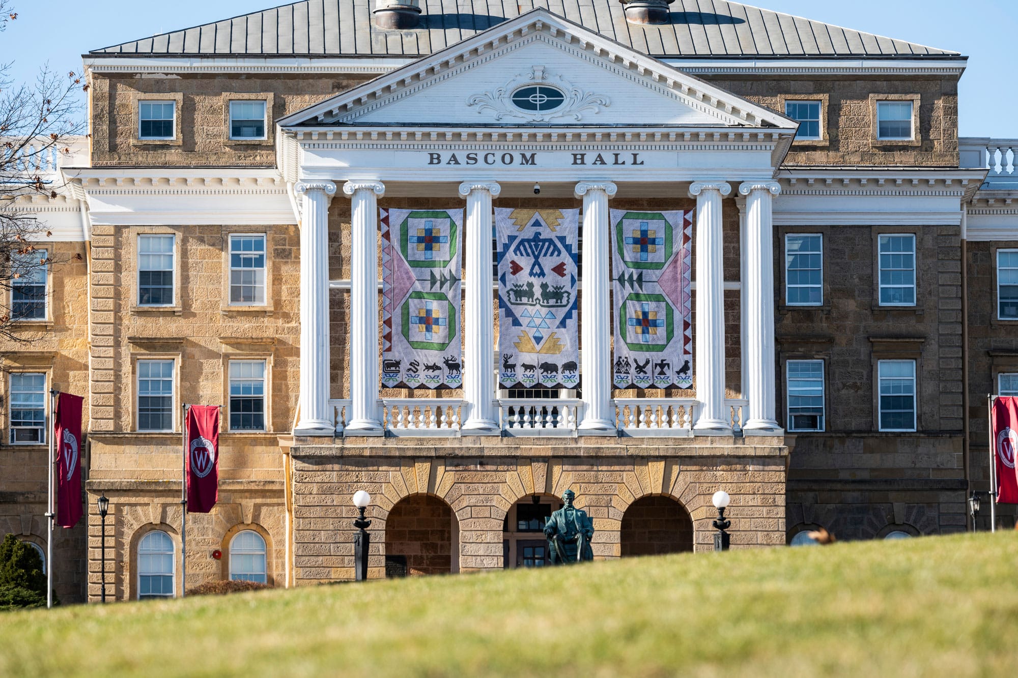 Pedestrians walking past Bascom Hall