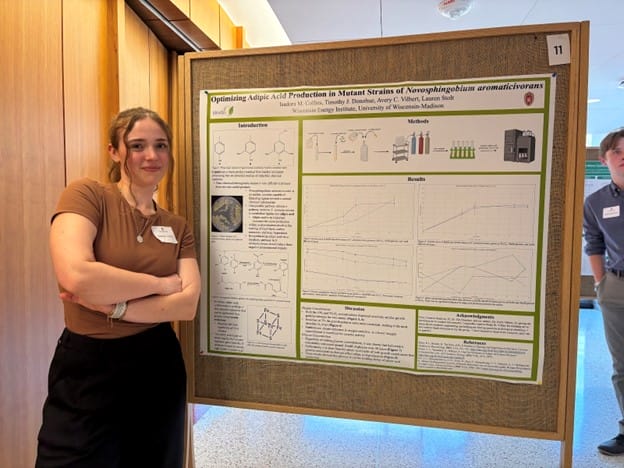 Isadora Collins standing in front of her poster board